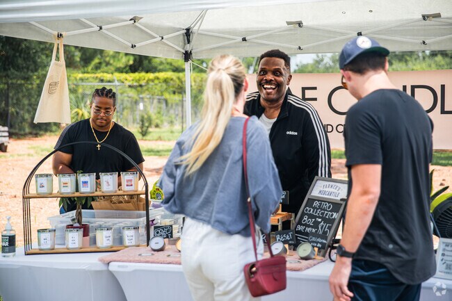 male vendor selling scented candles