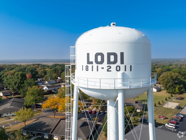 Lodi, OH’s water tower rises above tree-lined streets and community spaces.