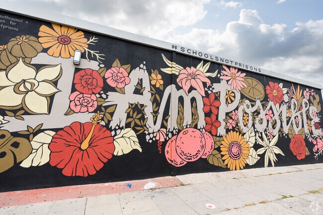 A beautiful community mural in Castle displays an uplifting phrase.