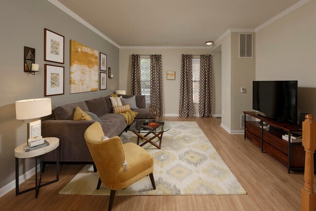 Espresso Finish Package townhome bedroom with carpet and accent wall