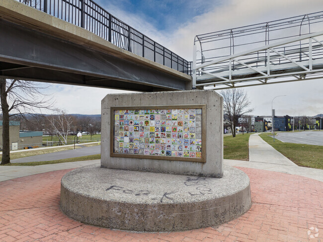 Art Tile Piece in Middle of Walkway to School