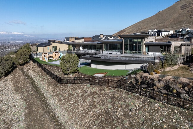 A row of mansions sits at the mouth of the canyon in Cottonwood Heights.