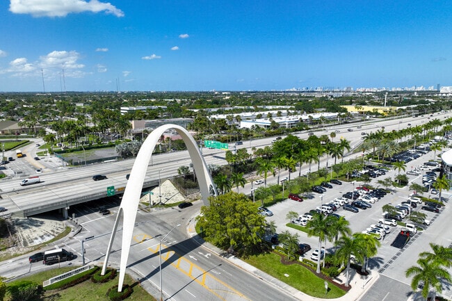 An arch stands by the Palmetto Expressway next to Scott Lake in Miami Gardens.