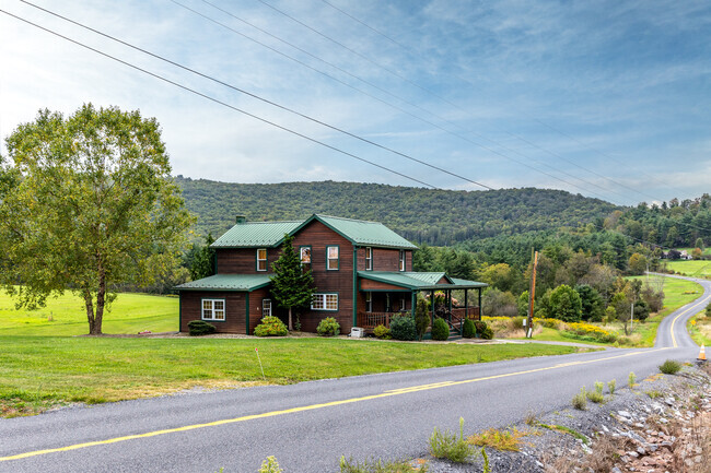 A beautiful home in Gamble sits along a scenic, winding road, offering a peaceful retreat.