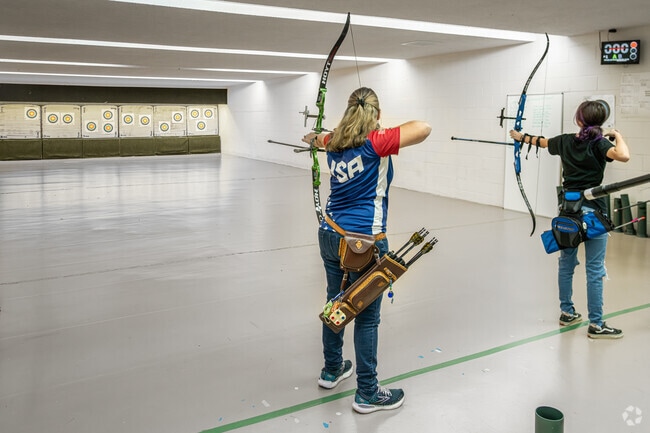 2012 Olympian, Cindy Bevilacqua instructs a student archer at Middletown Archery in Lima.