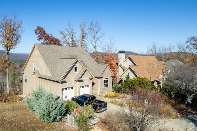 Two-story Shady Grove homes near town often list off-lake around $400k–$700k.