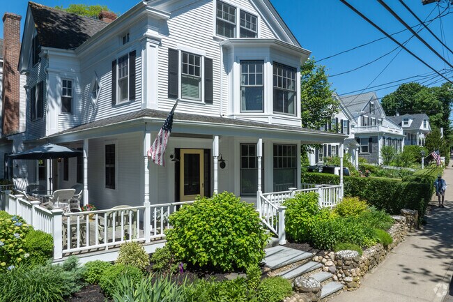 Large porches on this row of homes in Vineyard Haven offer plenty of shade on hot summer days.
