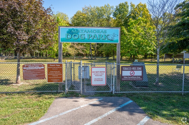 Matamoras Dog Park offers a large fenced area for dogs to run and play.