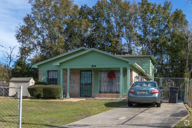 Midcentury ranch-style homes and bungalows line packed residential blocks in East Prichard.