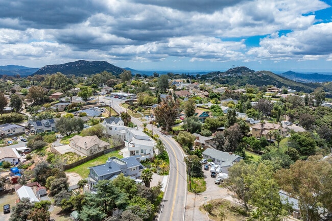 An elevated view above Crest shows the hilly landscape and windy roads.