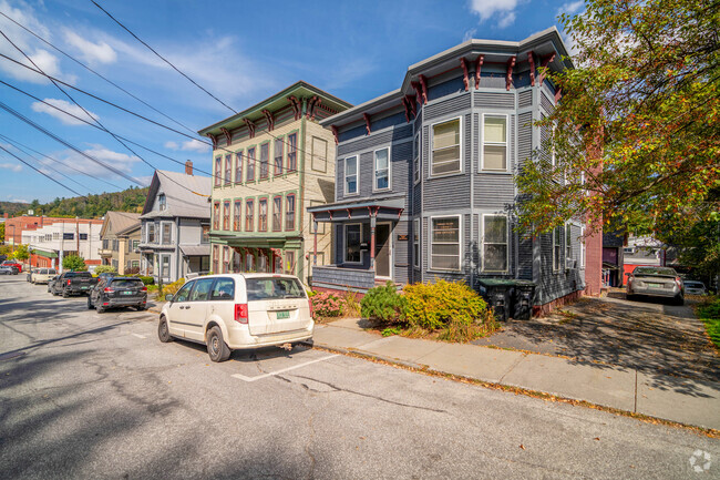 A row of historic homes in Downtown Montpelier glint in the morning sunlight.