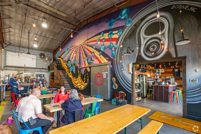 Lost Province Brewing in Boone offers award-winning craft beers and wood-fired pizzas, creating a vibrant local spot near Sugar Grove, NC.