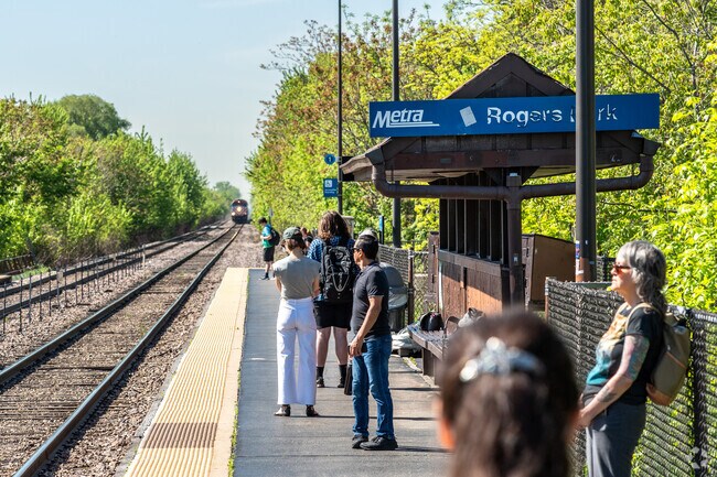 Commuters await the Metra train in the West Rogers Park neighborhood.
