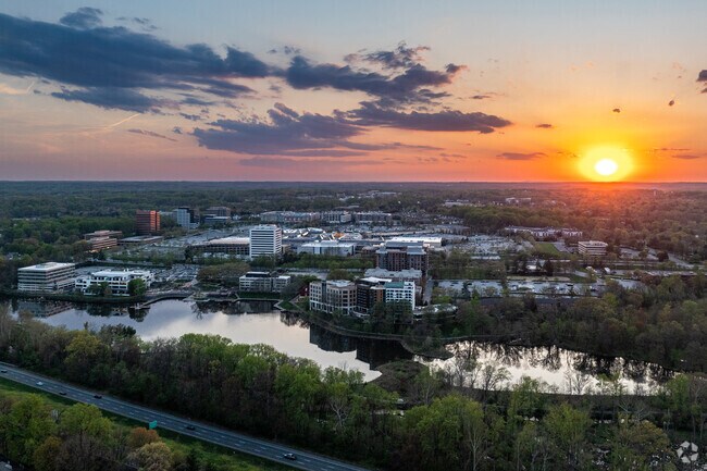 Lake K is illuminated by the springtime sunset over Oakland Mills.