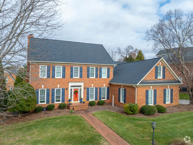 A lovely brick colonial revival with a spacious yard on Cross Vine Ln.