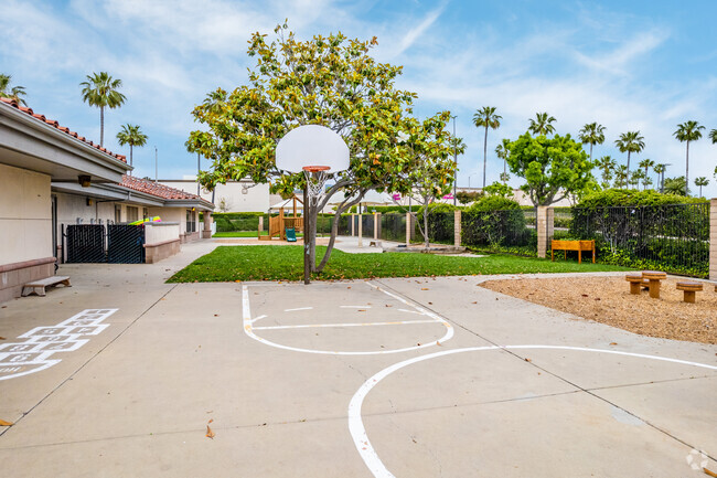 A basketball hoop and play areas provide stimulation for children at Guidepost Montessori.
