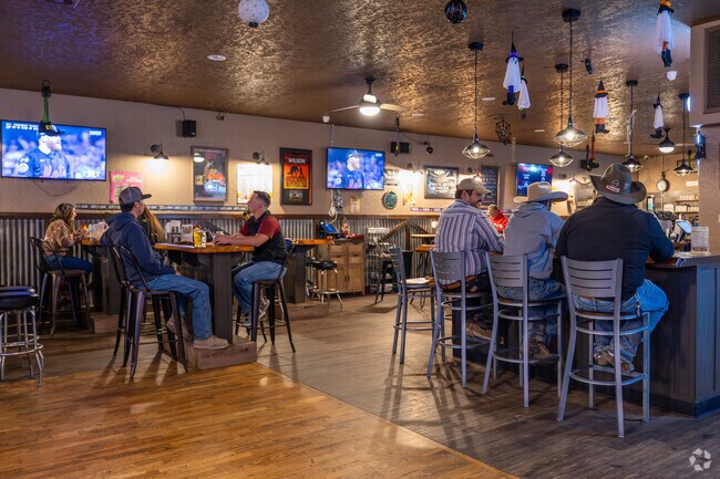 Friends gather to eat and drink in Finley's Longbranch Saloon .