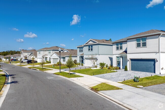 Paver driveways add character to this row of beautiful homes in Intercession City.