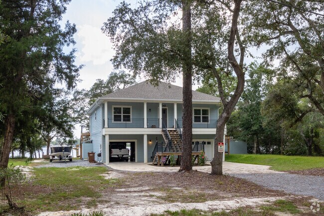 There are many waterfront homes along the shores of East Bay in Holley, FL.