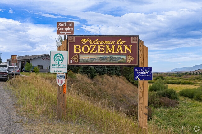 A beautiful wooden sign welcomes visitors to Midtown and downtown Bozeman.