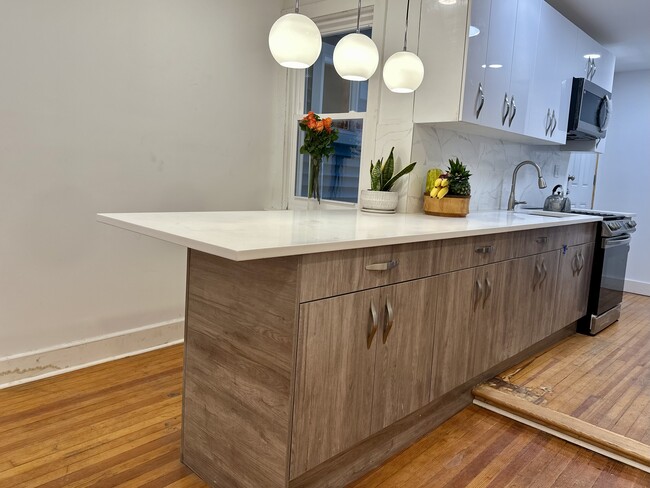 Family Kitchen Island, original wooden floor.