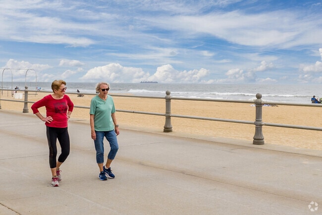 Two women enjoy the boardwalk near Linkhorn Park, just blocks from the Virginia Beach oceanfront.