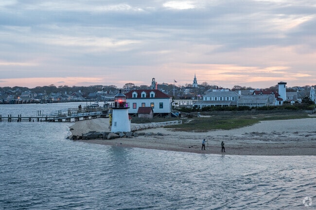 Fishermen cast their lines into Nantucket Harbor near Brant Point Lighthouse.