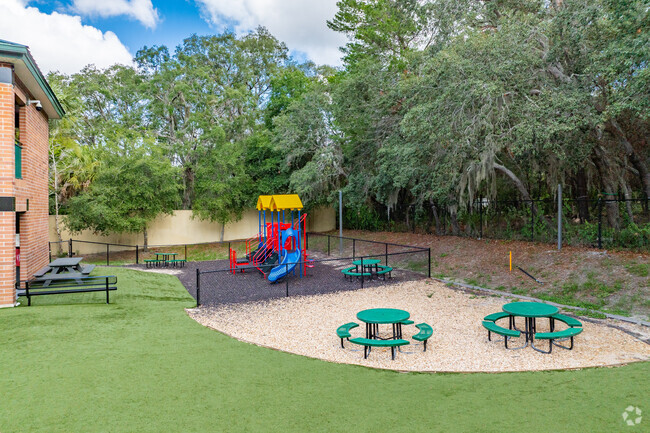 Kids enjoy playing on the play area at  
 Solid Rock Community School.