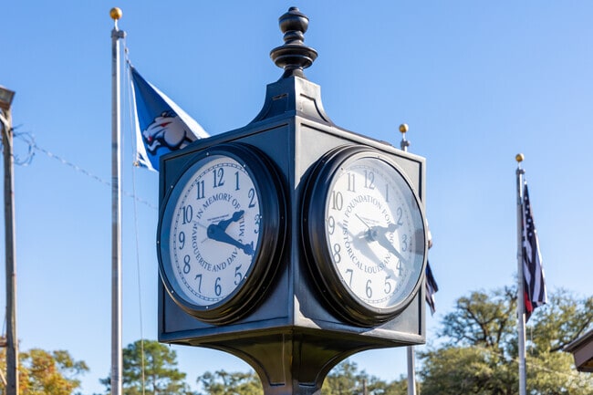 Find this clock in downtown Zachary next to the city's first train station.
