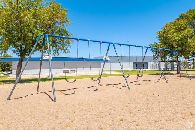 Experience the thrill of flying through the air on the swing set at Whitman Elementary in Mesa.