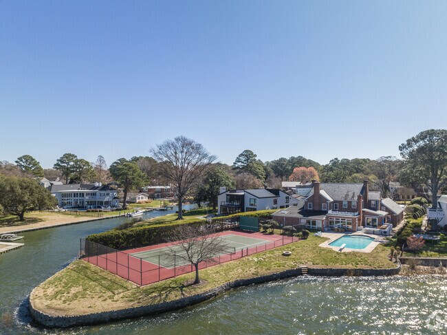 Waterfront homes in Riverpoint sometimes come with their own sports courts.
