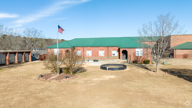 The American flag is on display at the entrance of Locust Elementary School.