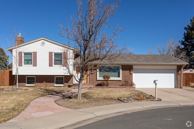 This Sable Ridge split-level home has great brickwork and a large front yard.
