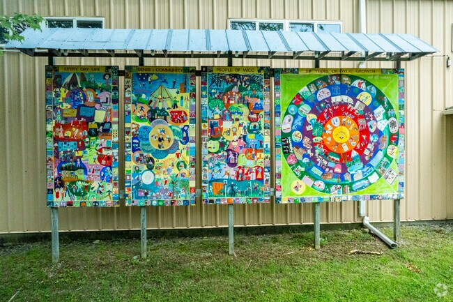 Student drawn murals hang on the front facade of Woodstock Day School.