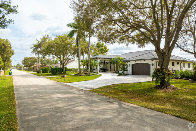 A row of modern ranch-style homes in Southwest Ranches.