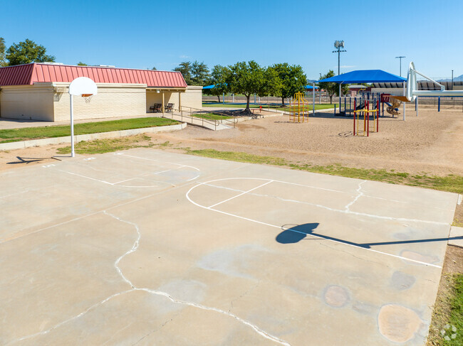 Shoot some hoops during gym class at Salk Elementary School's basketball courts.