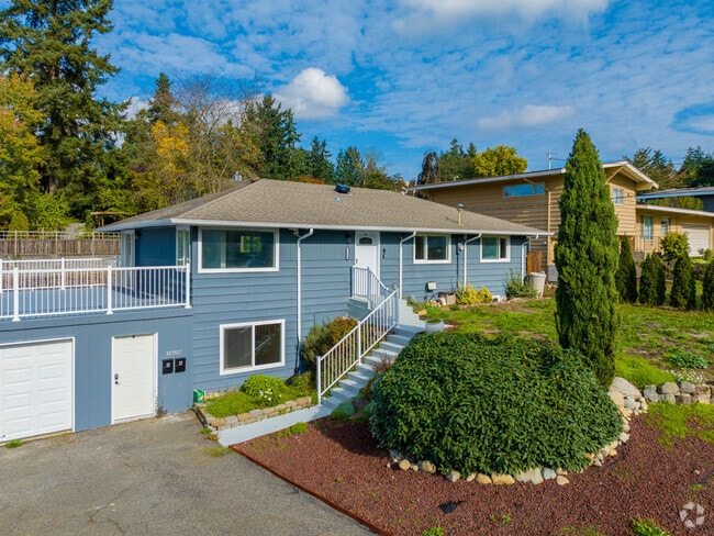 A baby blue and white split-level home in the Pacific Ridge neighborhood.