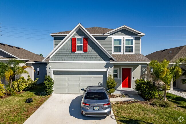 Two-story homes in Loughman feature bold architectural accents.