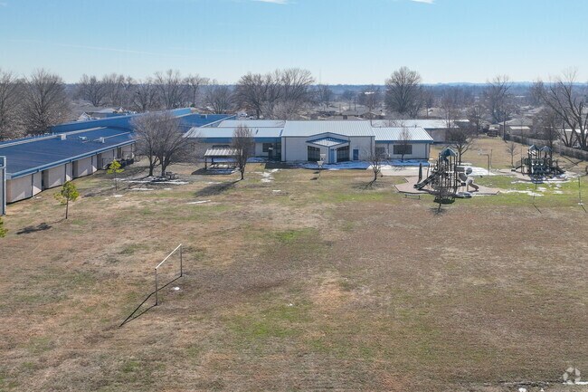Kerr Elementary School has a large field and playground for kids to exercise and play.