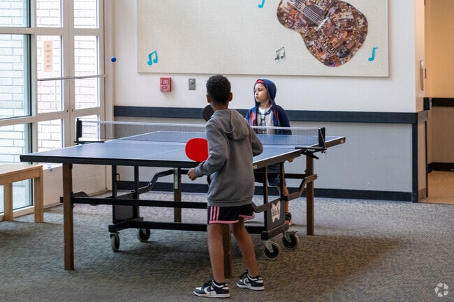 Kids enjoy playing ping pong at the East Portland Community Center.