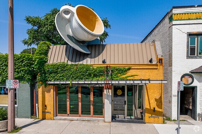 The iconic teacup sculpture atop the Caradaro Club Pizza is a Milwaukee landmark.