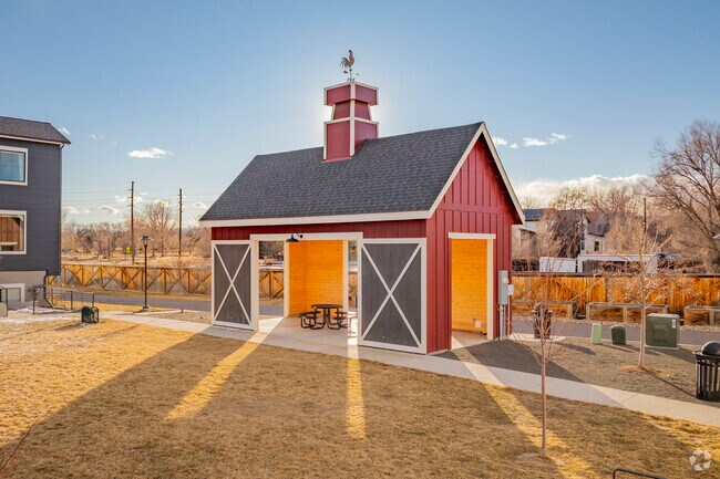 Louisville, Colorado's quaint architecture in its city parks, charms with its blend of historic and modern designs, featuring cozy cottages and vibrant storefronts that reflect the town's rich heritage and welcoming vibe.