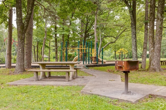 Birchwood Park in Walnut Valley offers a tree-covered playground and picnic tables.