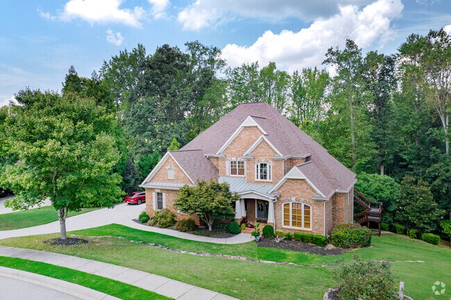 Brick constructed homes with a gable roofed design are found in Royal Lakes.