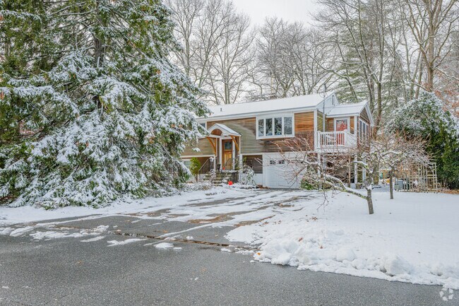 Homes nestle among evergreens on quiet Millville cul-de-sacs.