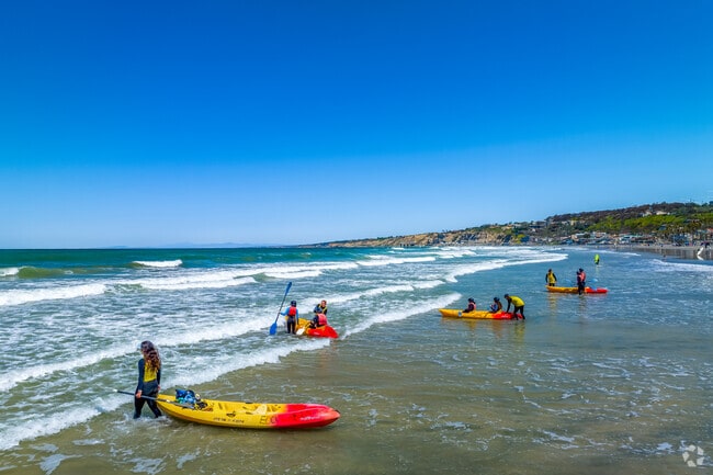 Kayakers flock to the water at La Jolla Shores near Hidden Valley.