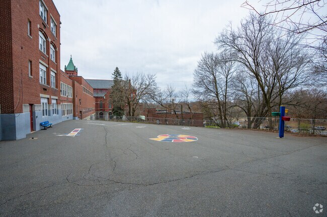 St. Joseph has a paved schoolyard behind the building for recess.