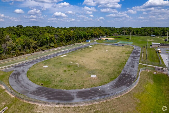 Students shine in front of their parent on the soccer field at Vanguard High School.