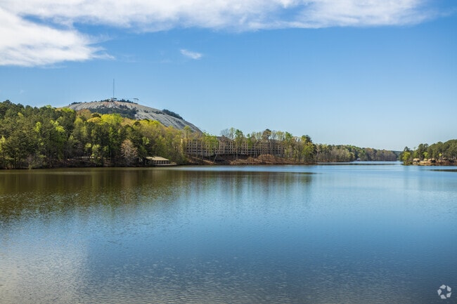 A scenic lake surrounding most of the local park is just outside of Stone Mountain.
