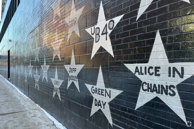 First Ave Stars mural painting in black and white.